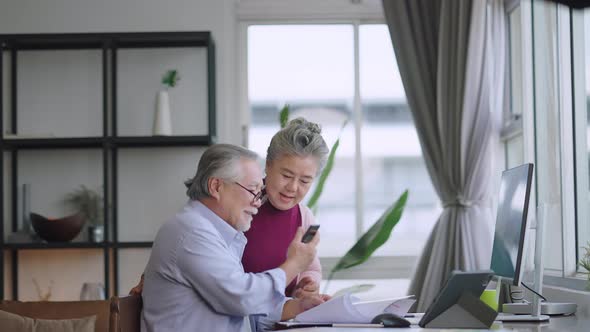 old senior asian retired people entrepreneur working together at home alt