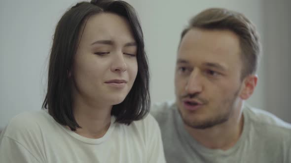 Portrait of Angry Man Shouting at His Wife at Home alt