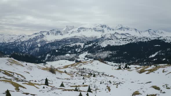 Aerial, Beautiful View On Snowy Dolomites Mountains On A Cloudy Day In Italy