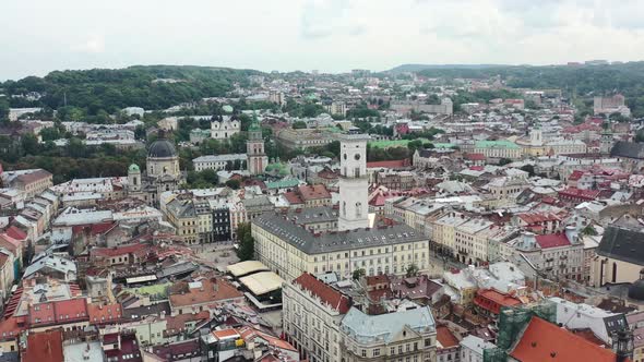 Rynok Square In Lviv Ukraine With The Ukrainian Flag Flying On Top Of A