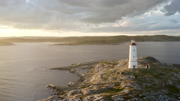 Sun Shining Over Skaggerak And Coastal Lighthouse At Lille Torungen Island In Norway. - aerial alt