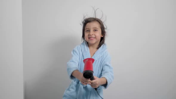 Portrait of a Five Year Old Boy After a Bath in a Blue Bathrobe and Dries alt