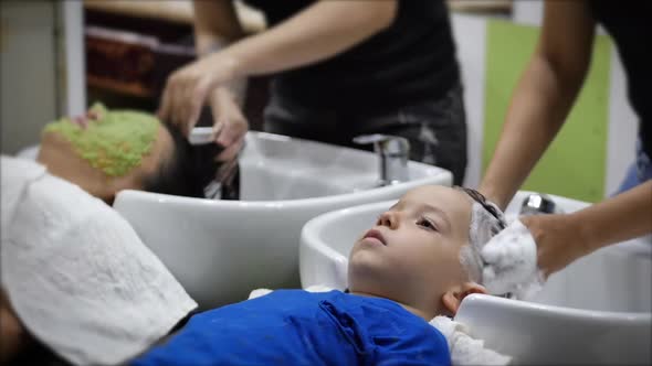 Parekhmacher, After Haircutting a Child of Preschool Age,wash Their Hair,soap with Shampoo,kid Lies alt