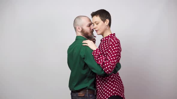 Romantic couple dancing on white background