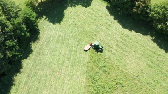 Green Tractor Hay Cutter Trees Aerial View alt