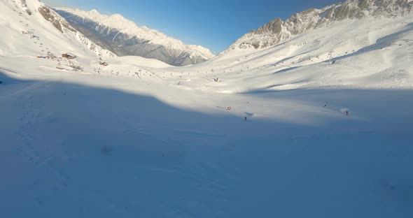 FPV Sport Drone Cinematic Shot Winter Ski Resort Landscape Panorama with Cableway Slope alt