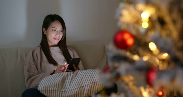 Woman Use of Mobile Phone for Sending Blessing Message to Friends  alt