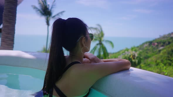 Girl Alone In Swimming Suit Relaxing In Luxurious Villa Sea View Infinity Pool