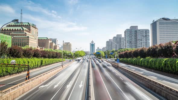 Time lapse of busy traffic and modern buildings in Beijing city , China. alt