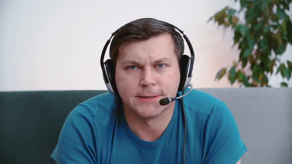 Caucasian male gamer player plays and wins in online video games alt