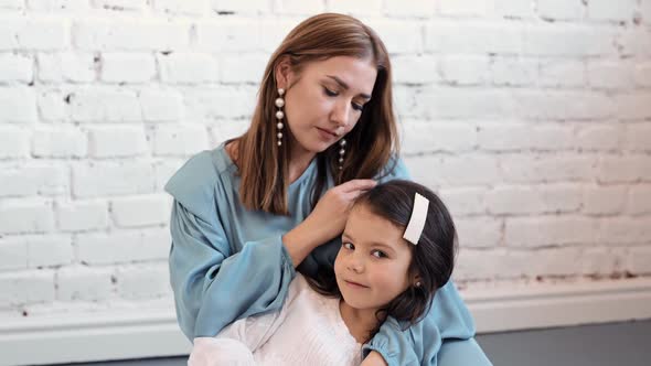 Loving Tender Young Mum Holding Adorable Cute Girl Daughter Embracing Kissing Small Kid alt
