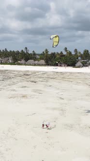 Vertical Video Kitesurfing Near the Shore of Zanzibar Tanzania alt