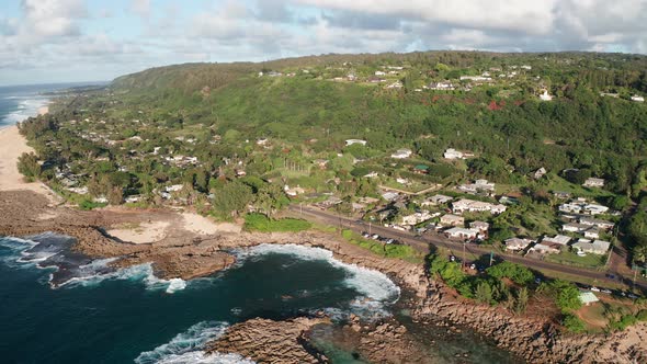 Aerial wide panning shot of the Hawaiian coast on the North Shore of O'ahu, Hawaii. 4K alt