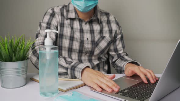 Man Clean Hands with Alchohol Gel to Protect Against Coronavirus or COVID19 alt