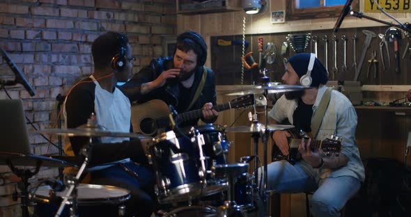 Young Musicians Rehearsing in Garage alt