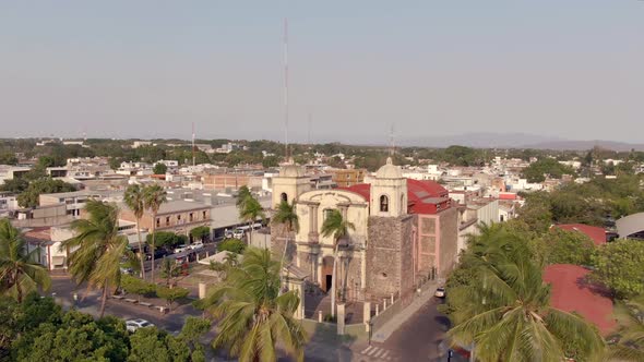 Aerial View Of Templo de la Merced From Jardin Nuñez In Colima, Mexico. - ascend alt