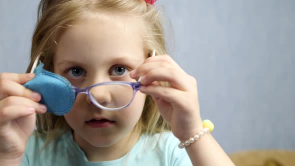 Little Girl Wears Glasses Having Bad Vision