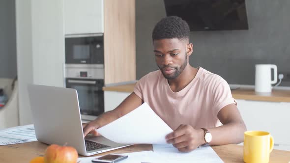 African Young Businessman Working at Home in His Day-off alt