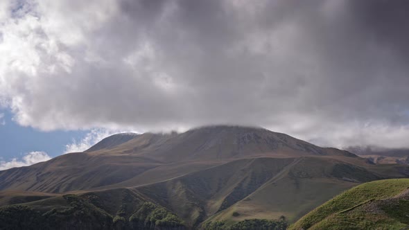 Timelapse of epic clouds and mountains alt