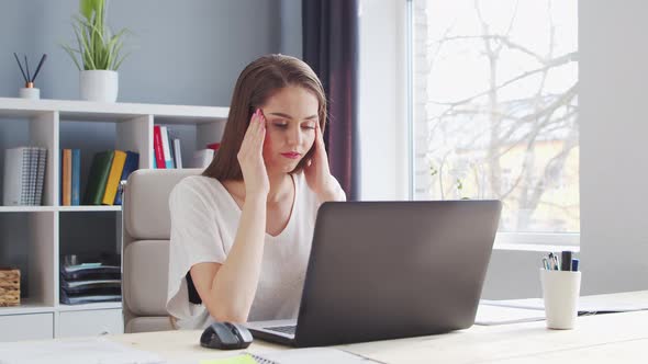 Young Woman Works at Home Office Using Computer. alt