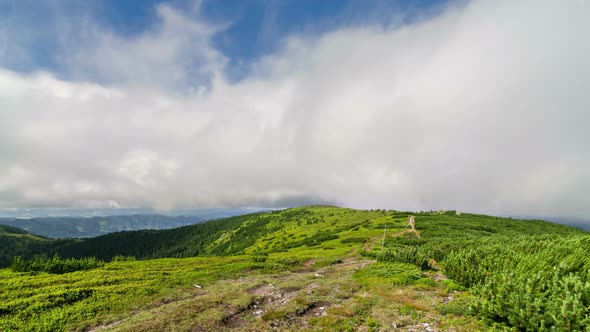Clouds Motion over Green Carpathian Mountains Ridge in Sunny Summer Nature alt