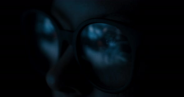 Close-up Female In Glasses Reflecting Computer Game
