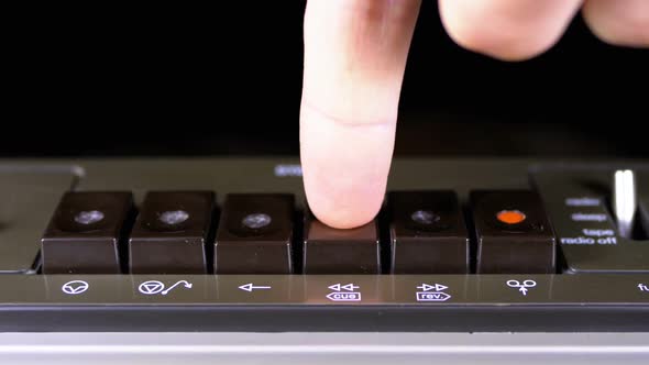 Pushing Play, Stop, Rec, Ff, Rew Buttons on a Tape Recorder alt