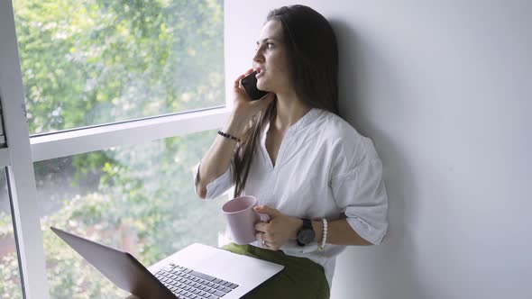 Woman Talk on the Phone in Modern Apartment