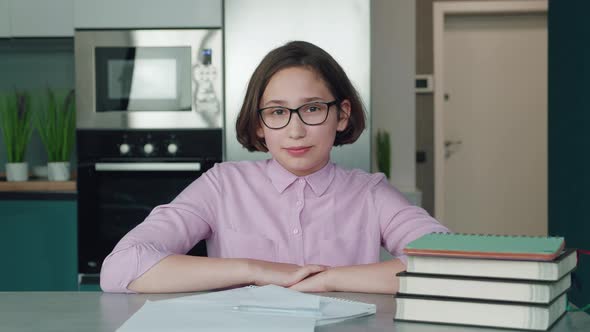 Happy Schoolgirl Pupil Wearing Headphones Raising Hand Distance Learning Online at Virtual Lesson alt