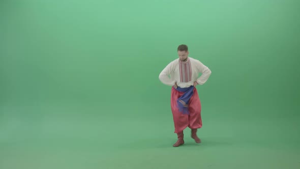 Slavic Dancing Man Dance Hopak In National Ukraine Costume Isolated On Green Screen alt