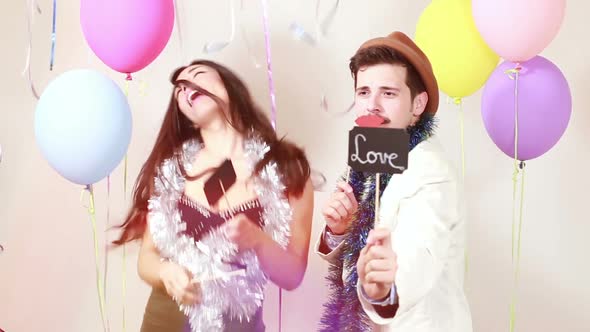 Slow motion of couple in love in photo booth alt