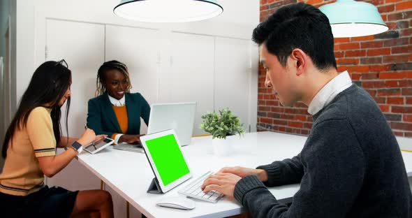 Business executives working at desk alt