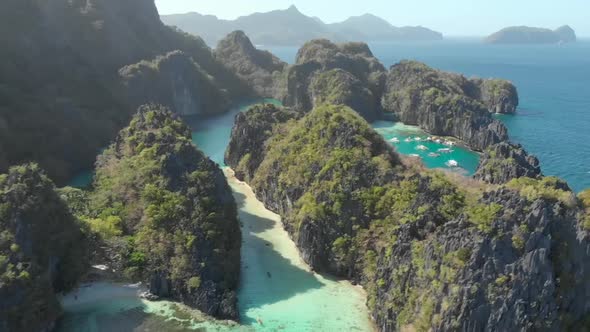 Aerial view of Big Lagoon with outrigger boats, El Nido alt