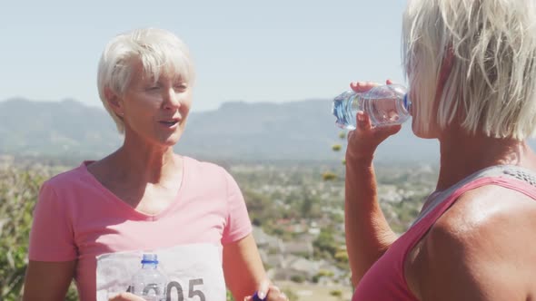 Athletics women drinking water alt