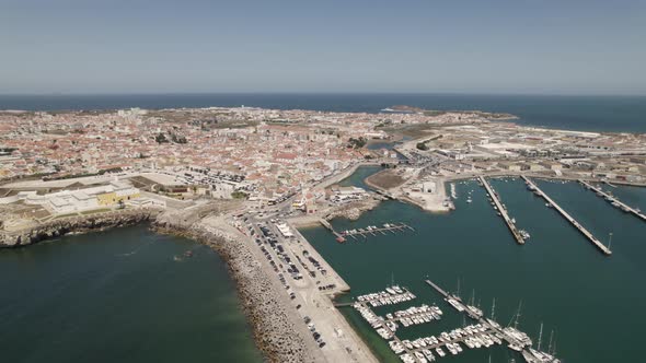 Peniche port and city in background, Portugal. Aerial orbit