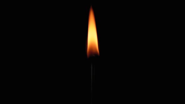 Lit Match and Flame on a Black Background and Then Goes Out Creating a Lot of Smoke alt