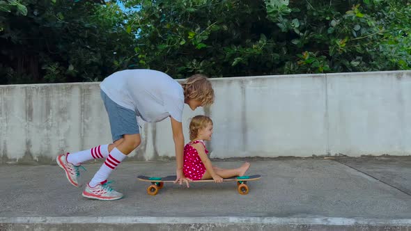 A Little Girl Rides on a Longboard alt