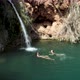 Girls Swimming In Beautiful Waterfall Lake - VideoHive Item for Sale