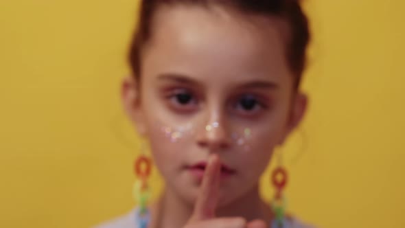 Kid Secret Disturbed Girl Showing Hush Gesture alt