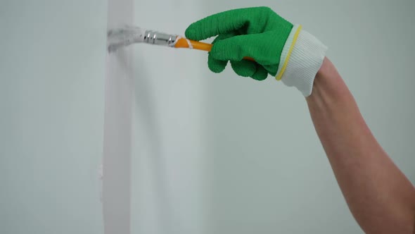 Closeup Female Hand Painting Wall with White Color Indoors, Stock Footage