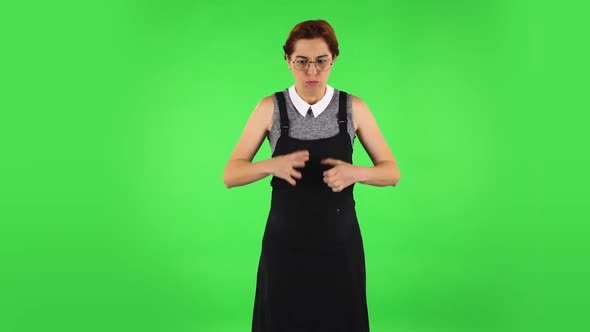 Funny Girl in Round Glasses Annoyed Gesturing in Stress Expressing Irritation. Green Screen alt
