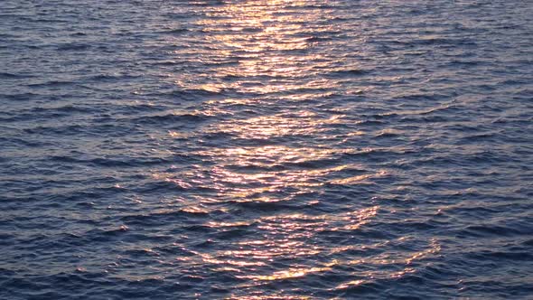 Looped Video of Beautiful Water Surface and Sun Over Horizon