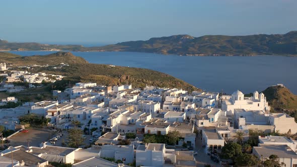 Panoramic View of Plaka Village with Traditional Greek Church. Milos Island, Greece alt