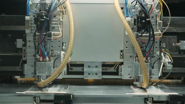 base of printed circuit board is processed on digital equipment at factory