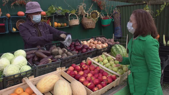 Buying Beets in the Market. 2 Shots. alt