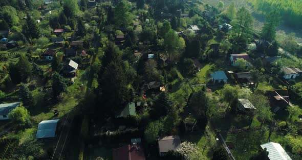 Aerial view on allotment gardens in the suburbs. alt