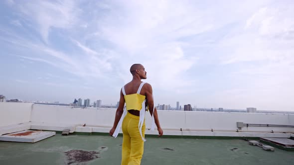 Models In Clubwear Dancing And Performing Together On Skyscraper alt