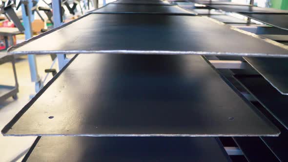 Freshly coated food manufacturing trays drying alt