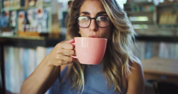 Young Woman Drinking Coffee