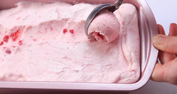 Scooping Homemade Strawberry Ice Cream